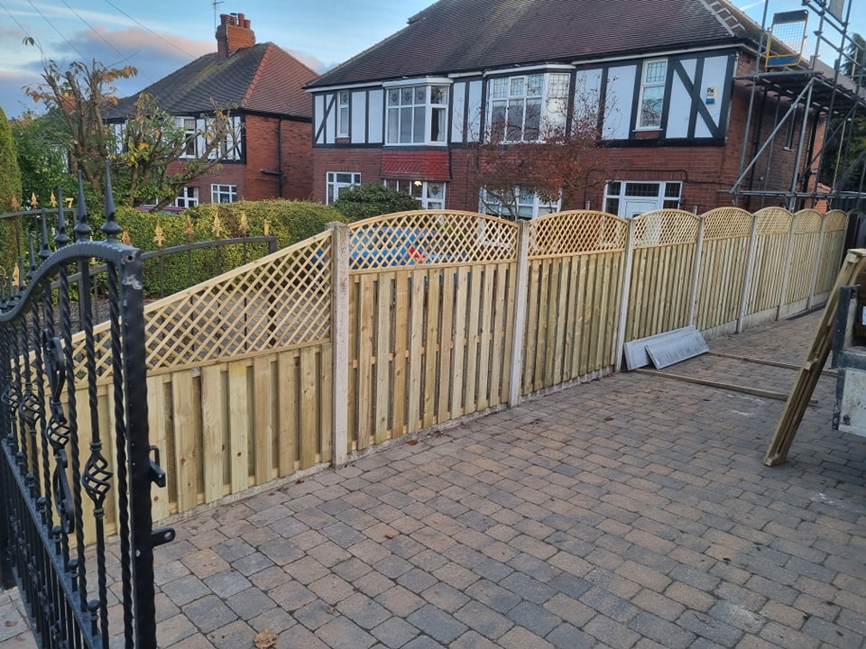 Wooden garden fencing installation with decorative lattice topping, enhancing curb appeal and privacy in a residential area, showcasing CK Fencing Contractors' expertise in Castleford.