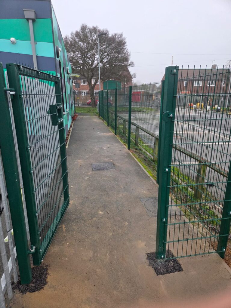 Pathway with 1.8m twin mesh fencing and double gates at Faurburn View Primary School, showcasing secure access and boundary protection.